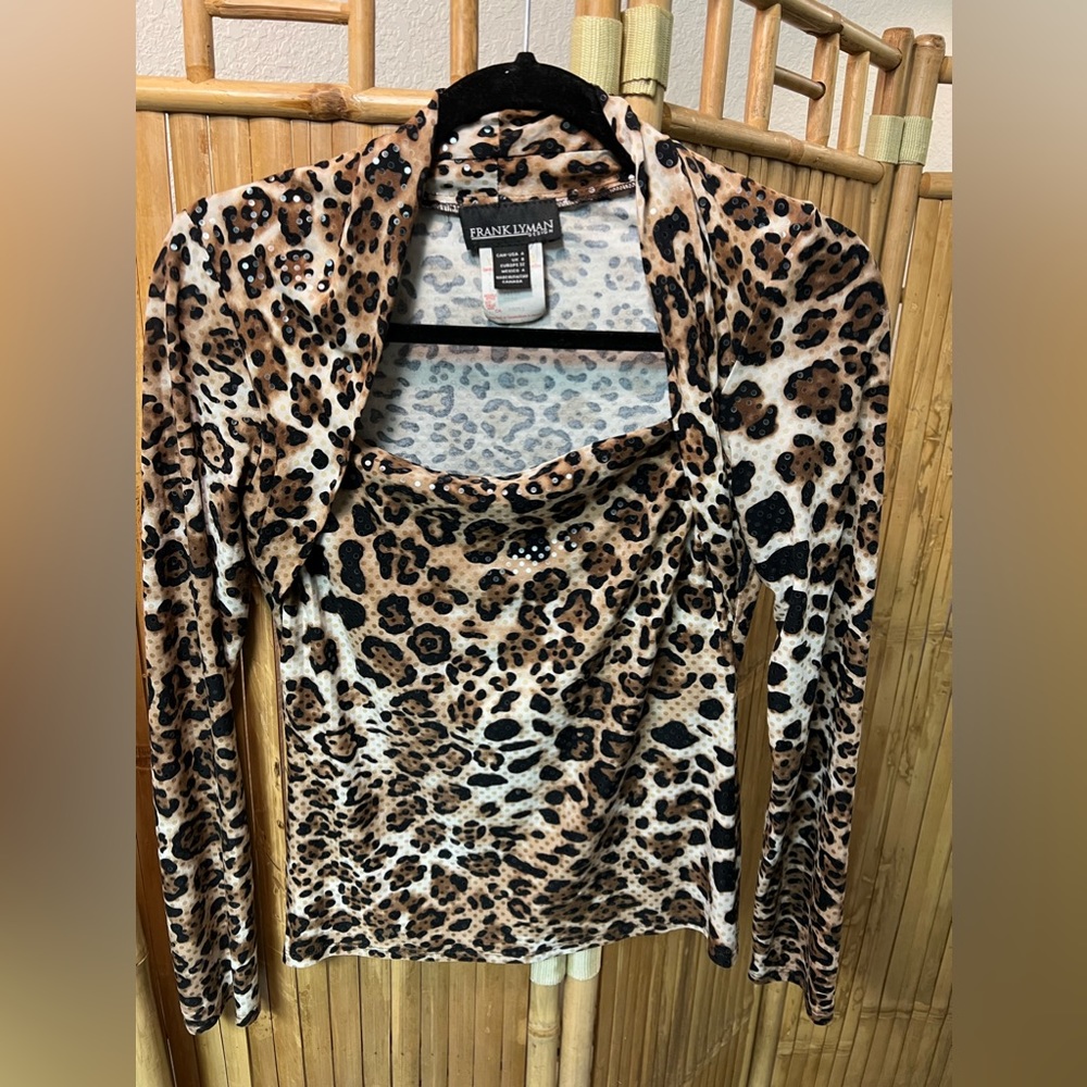 Frank Lyman design. Polyester/ elasthane. Size 4. Animal print